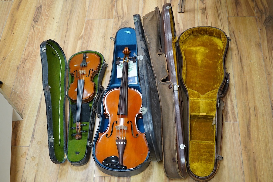 A quantity of violin parts and violins, a ukelele, a double bass scroll, a pinfold metronome, a violin case by Hill, a viola etc. Condition - for restoration